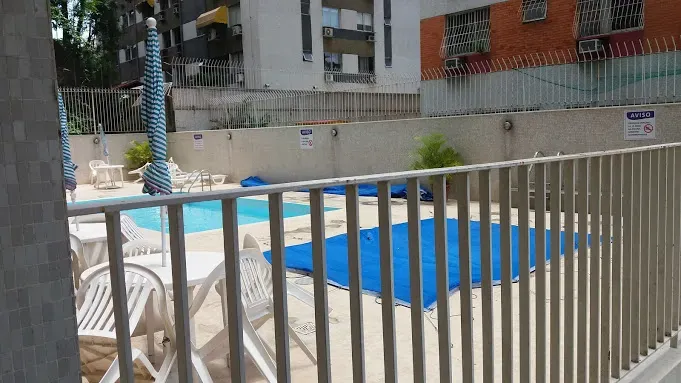 2-bedroom apartment in a building with a pool — photo 30