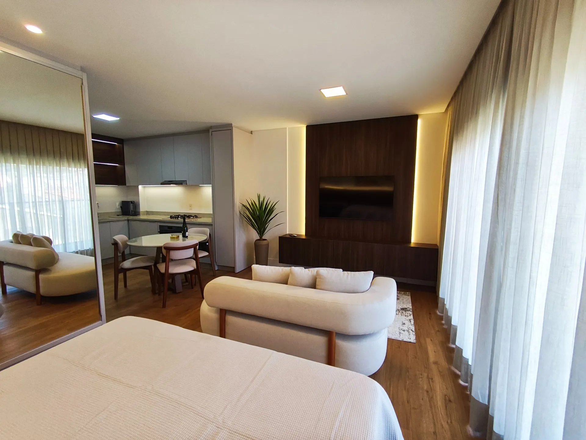 One-bedroom apartment in a building with a heated pool