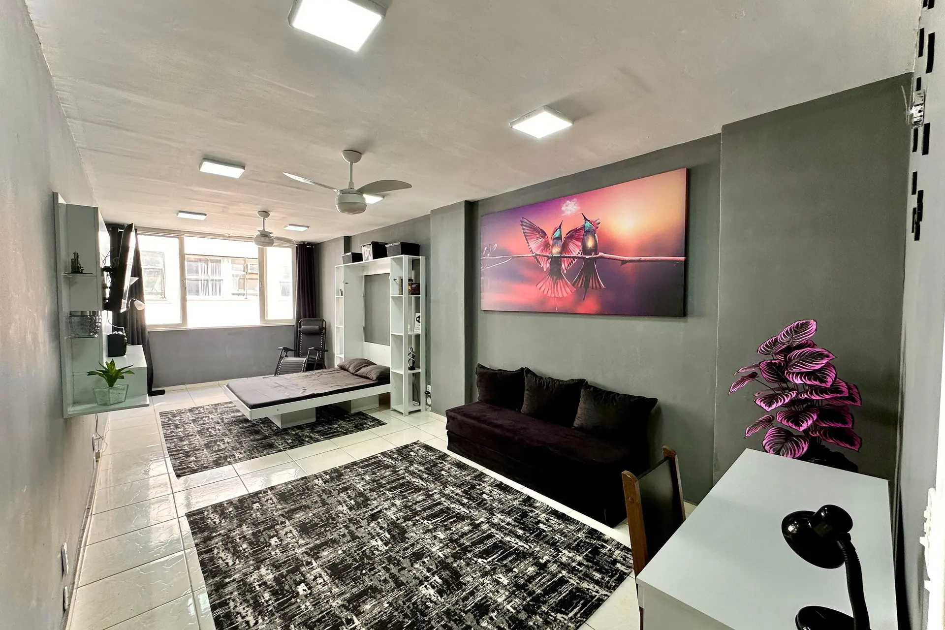 Furnished studio with 1 bedroom and a glass shower