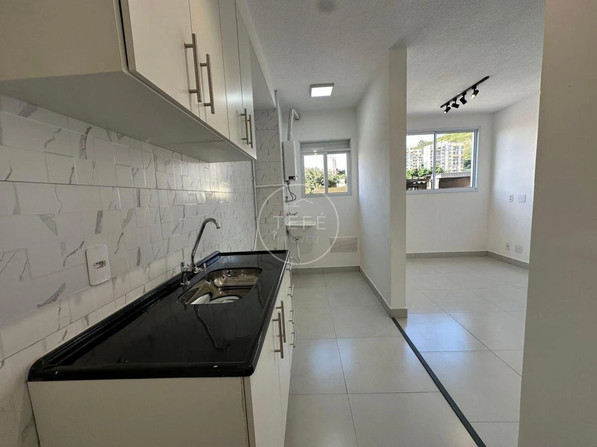 One-bedroom apartment in a building with a pool — photo 8
