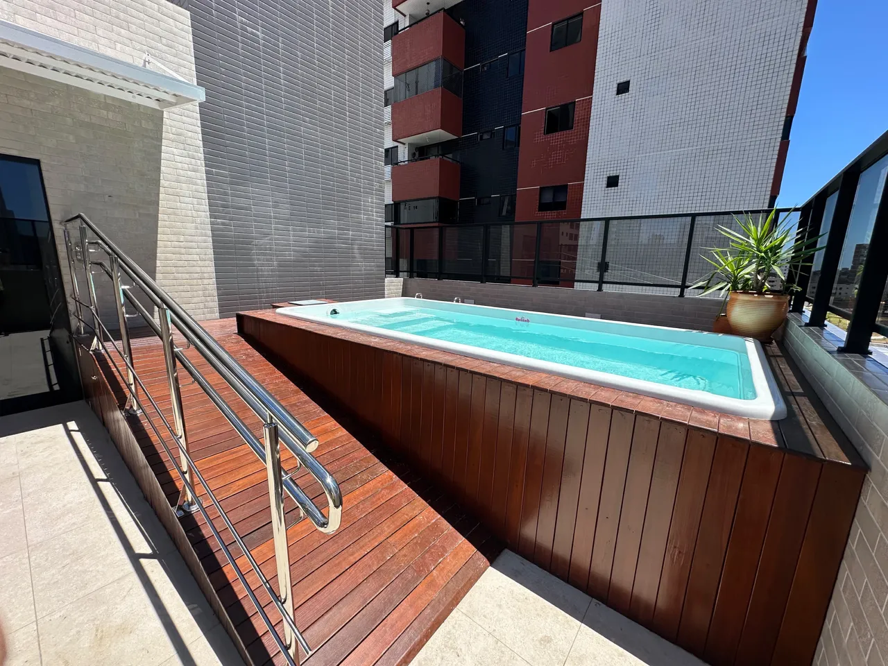 2-bedroom apartment in a building with a pool — photo 4