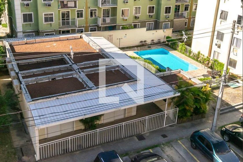 2-bedroom apartment in a building with a pool — photo 12