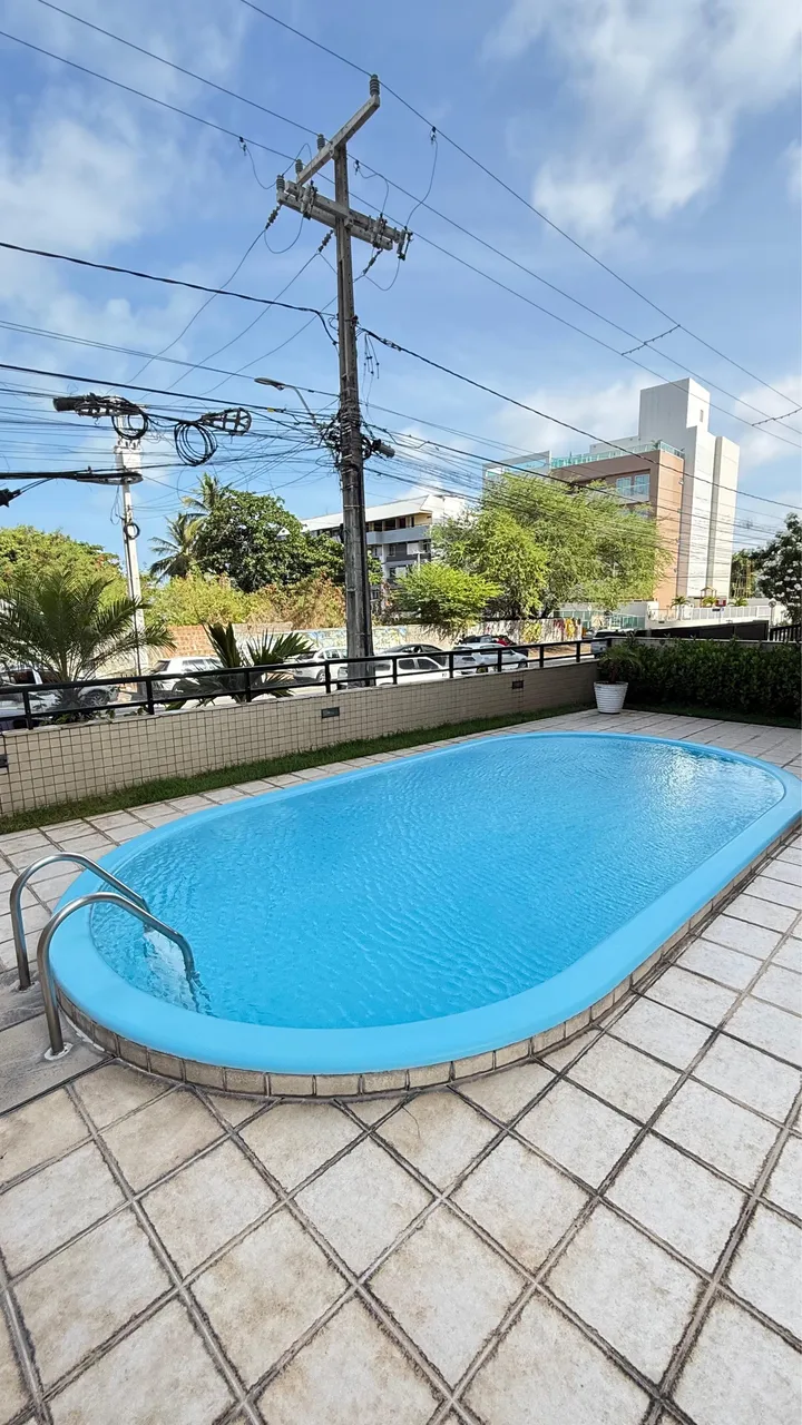 3-bedroom apartment in a building with a pool