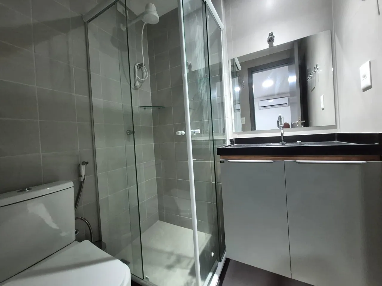 1-bedroom apartment with a compact kitchen and microwave — photo 4