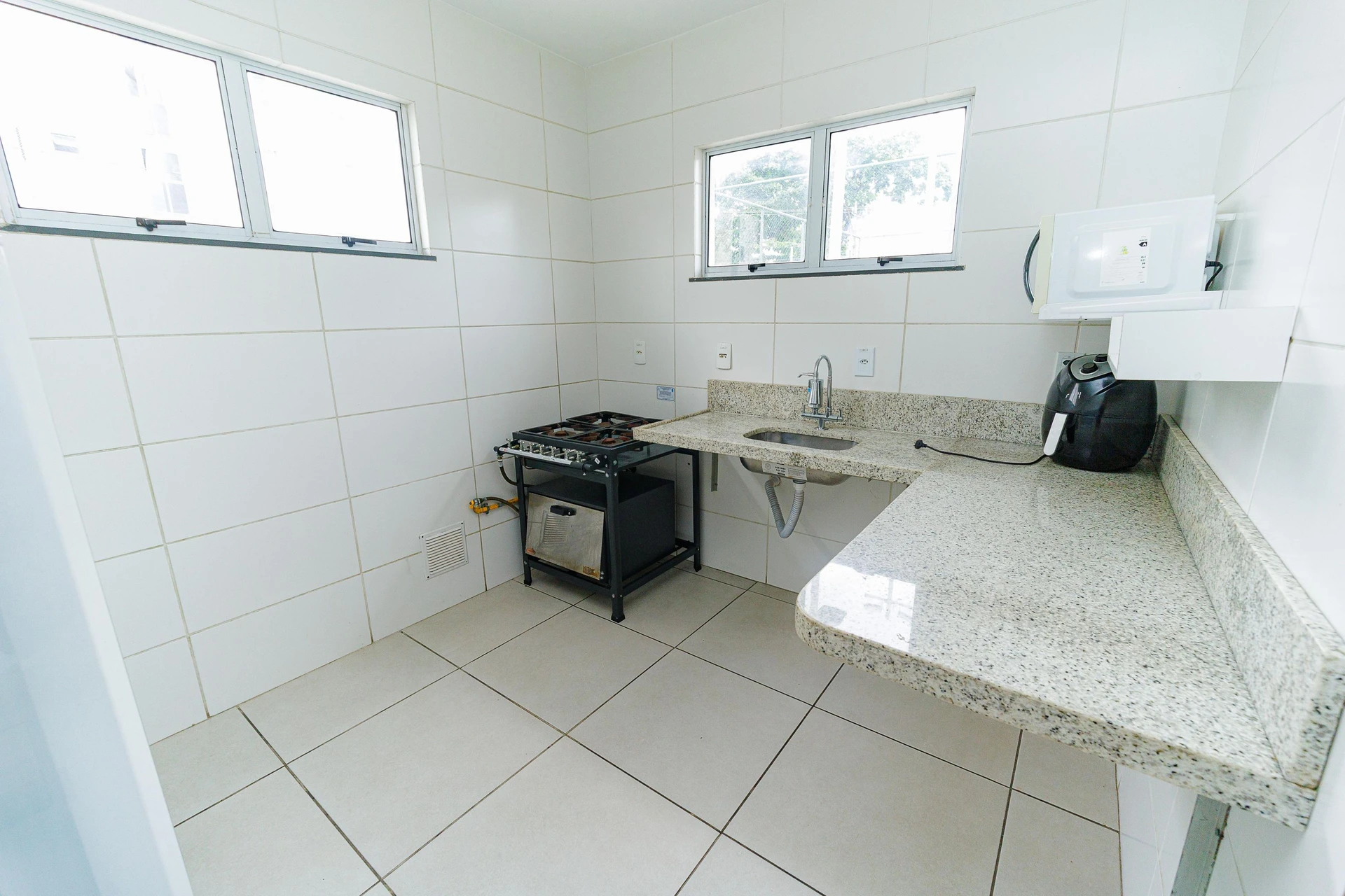 2-bedroom apartment in a building with a pool — photo 19