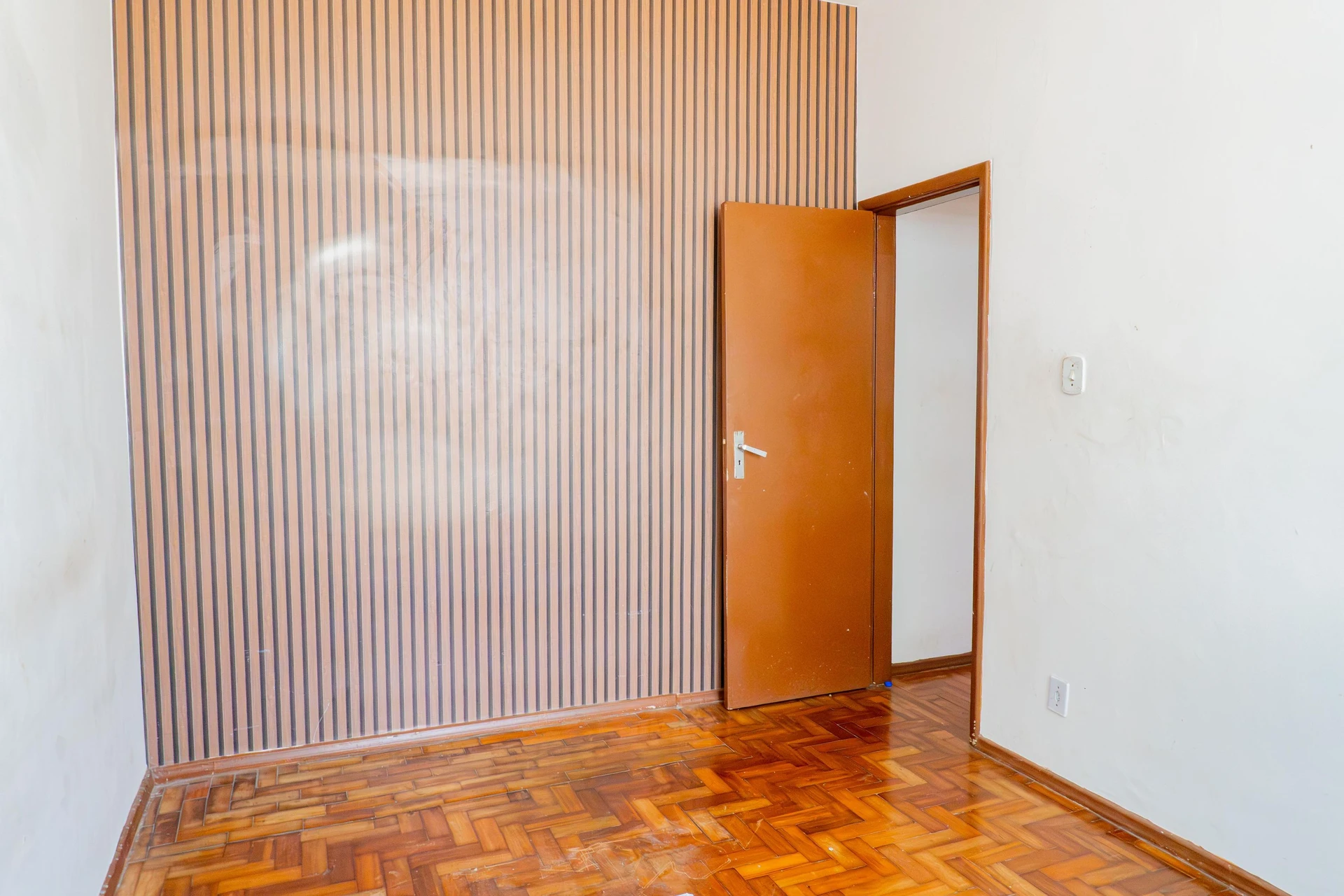 One-bedroom apartment with wood or laminate floors — photo 11