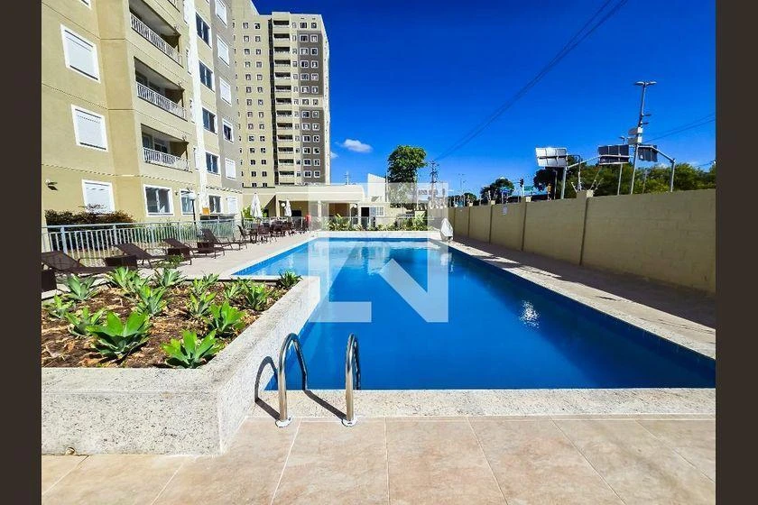 2-bedroom apartment in a building with a pool — photo 12