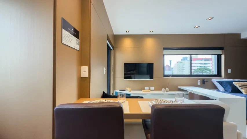 Furnished studio with open-plan kitchen and balcony — photo 17