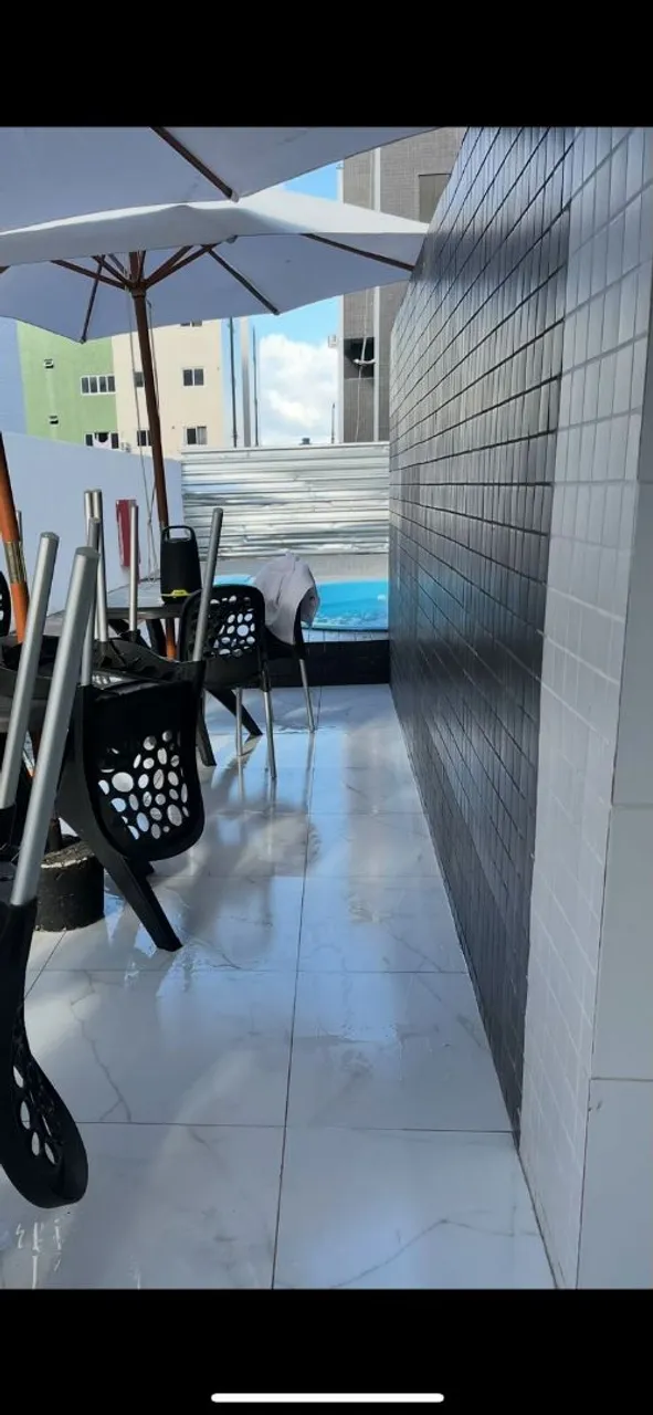 2-bedroom apartment in a building with a pool — photo 10