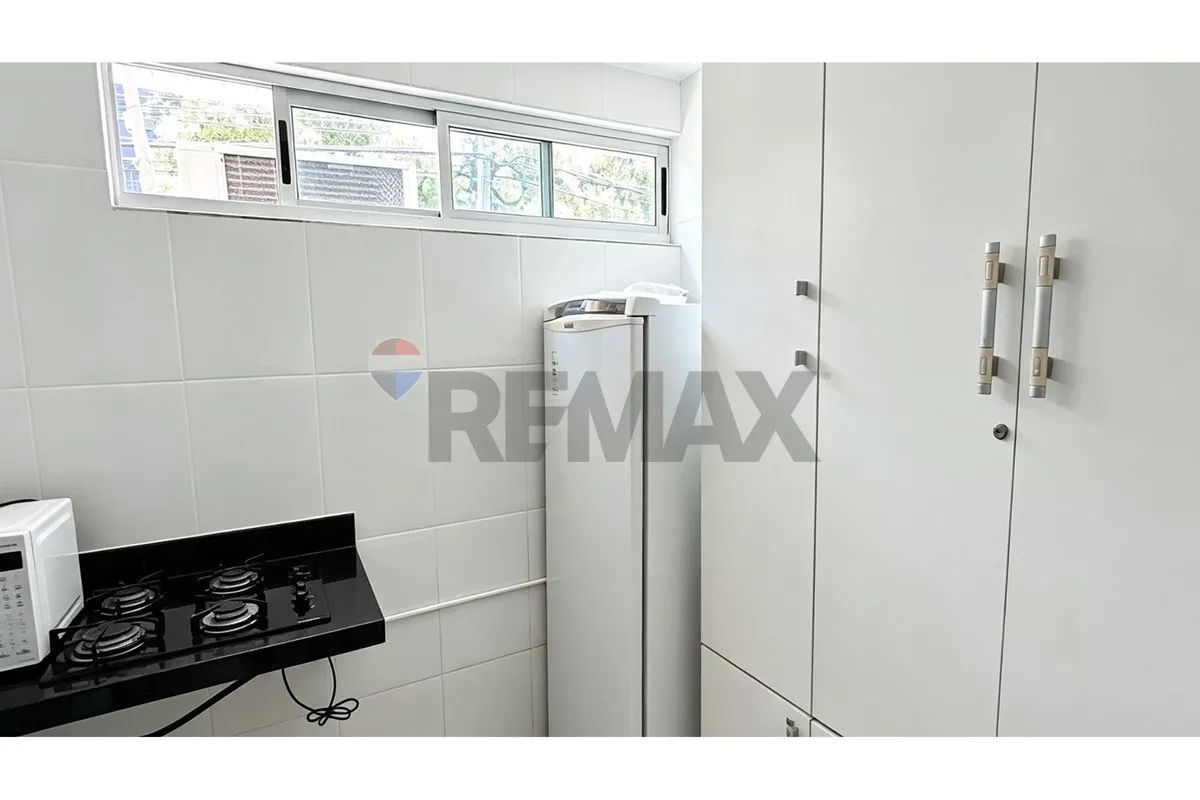 One-bedroom apartment in a building with a pool — photo 11