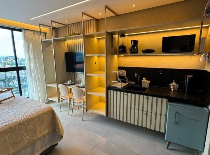 1-bedroom apartment with a compact kitchenette and microwave — photo 6