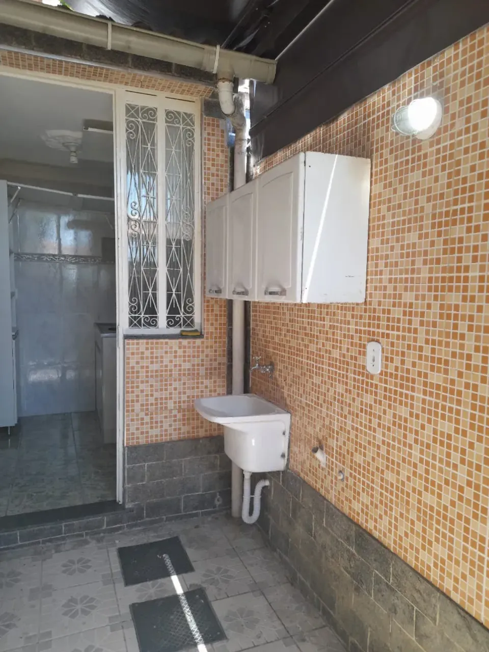 House with laundry area and a utility sink — photo 5