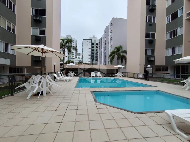 2-bedroom apartment in a building with a pool — photo 3