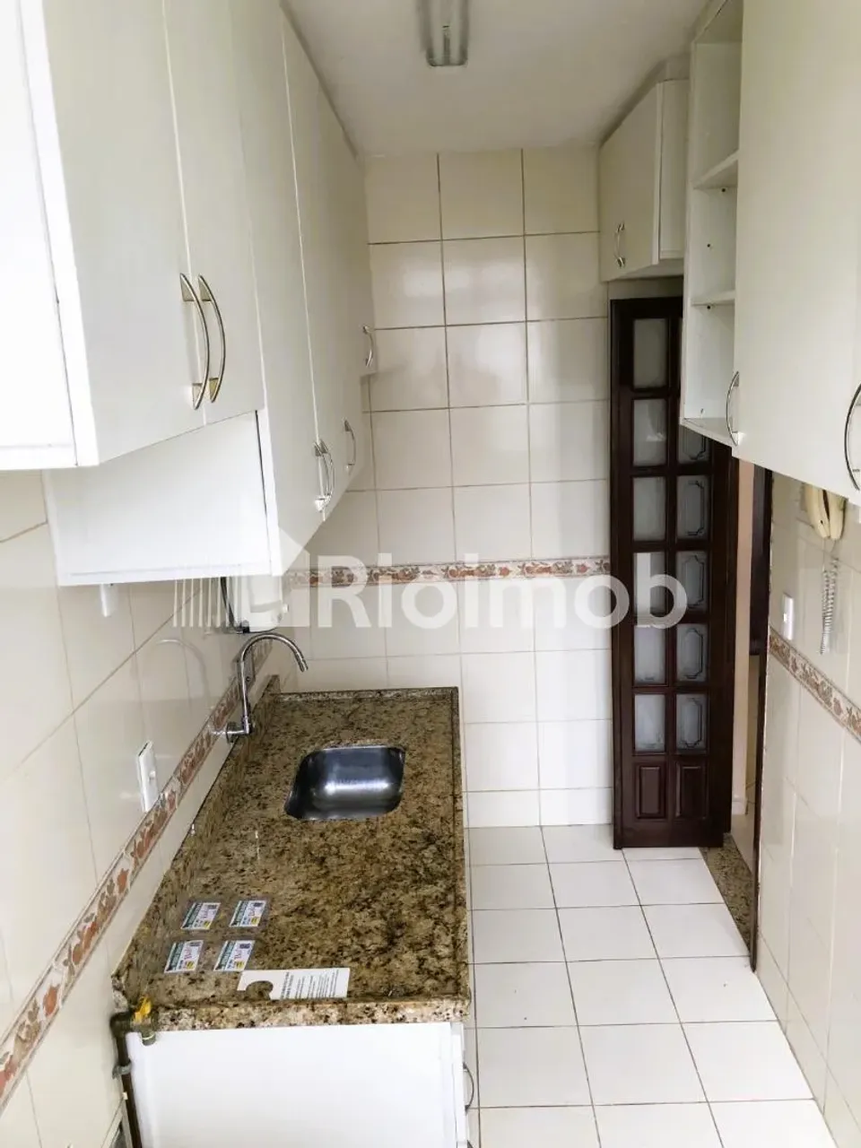 2-bedroom apartment in a building with a pool — photo 2