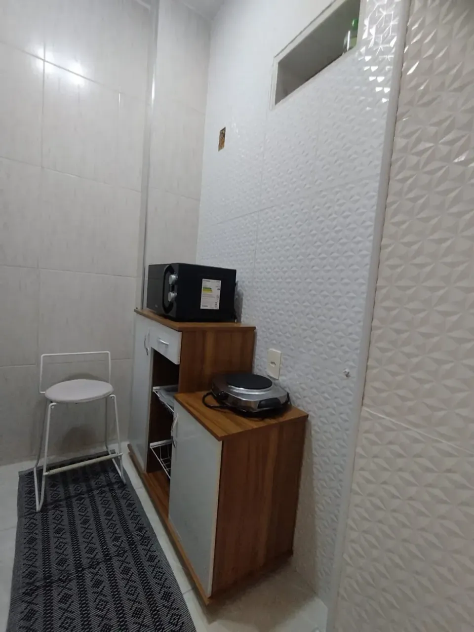 Furnished apartment with a compact cooking setup — photo 17