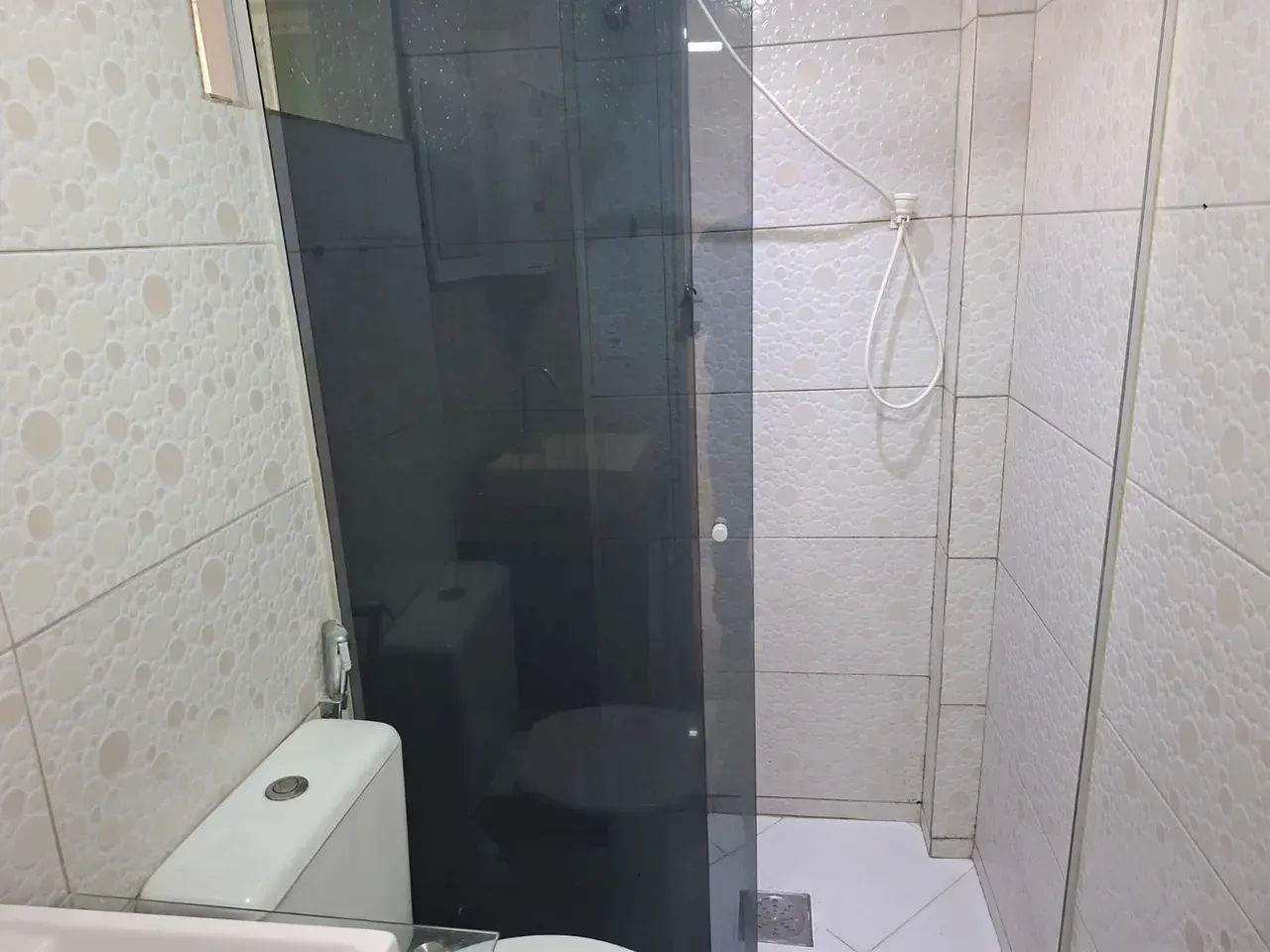 1-bedroom apartment with tiled floors and glass shower — photo 8