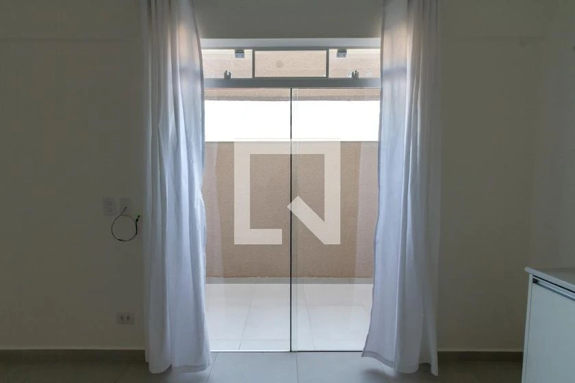 Furnished studio with a compact kitchenette and private garden