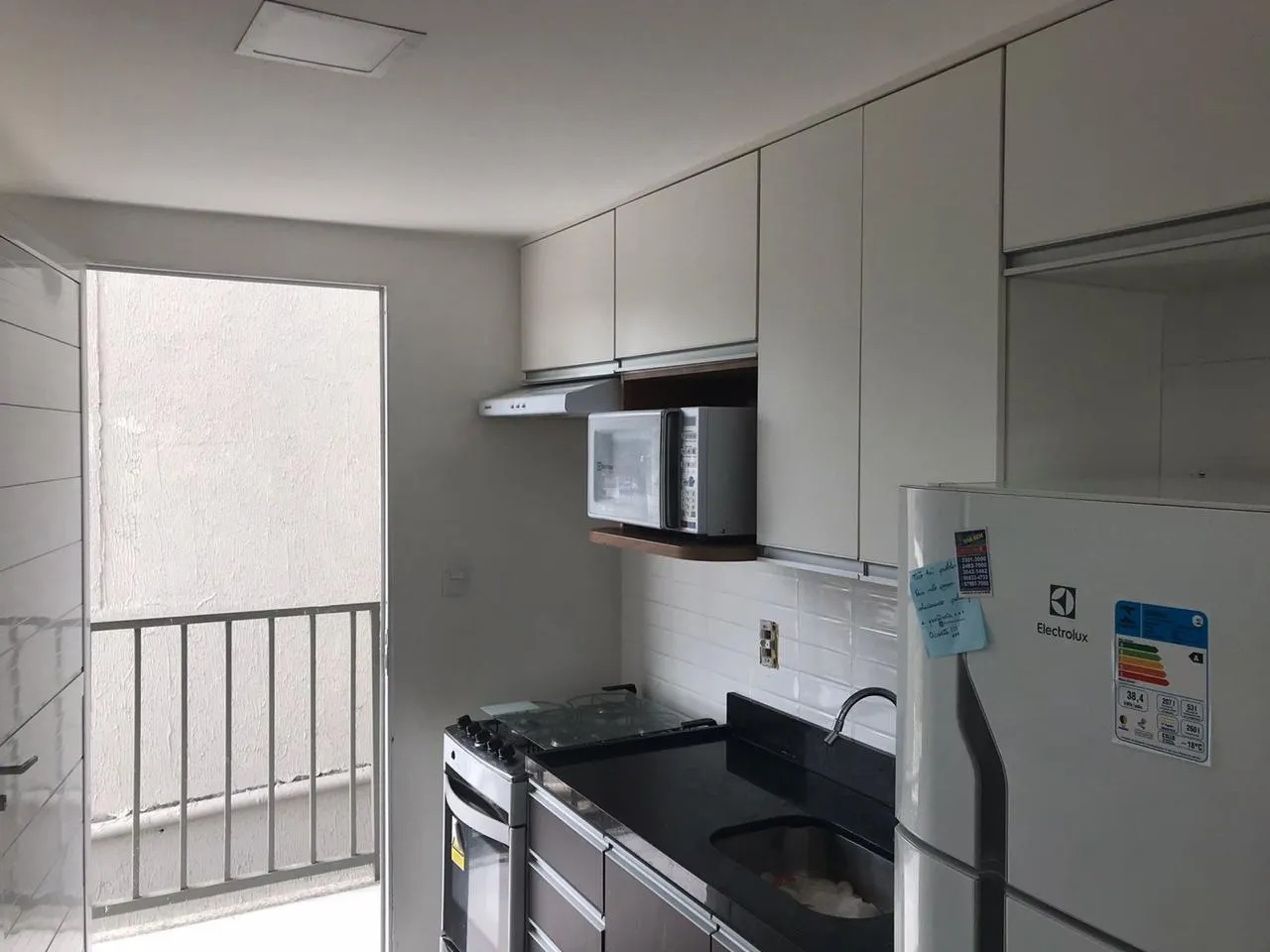 Furnished studio-style apartment with open-plan kitchen — photo 17