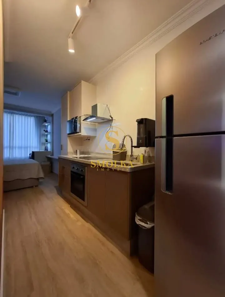 Furnished studio with integrated kitchen and glass shower — photo 7
