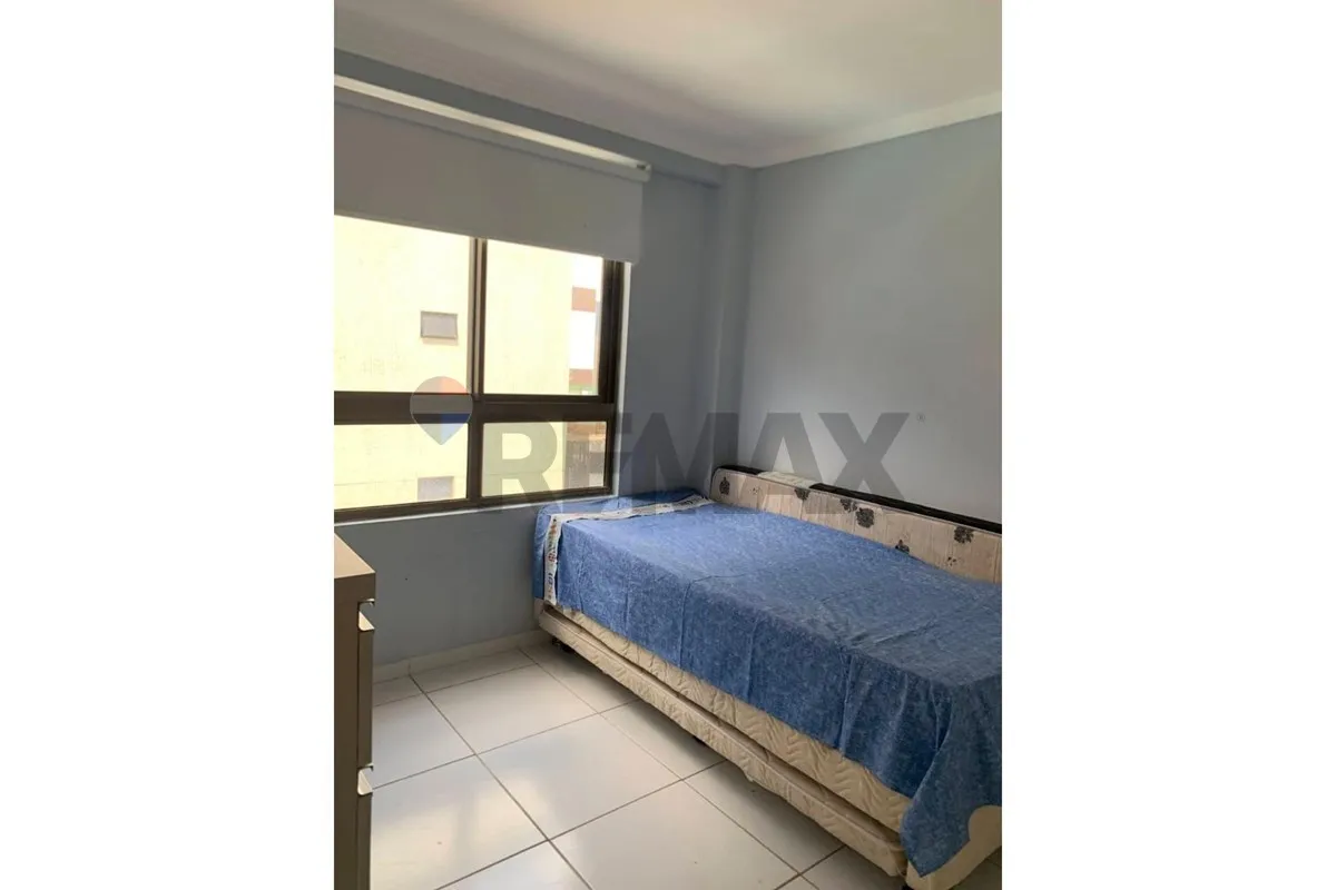 2-bedroom apartment in a building with a pool — photo 11