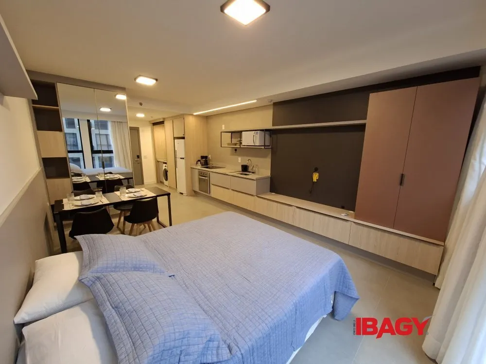 Furnished studio with a glass-enclosed balcony