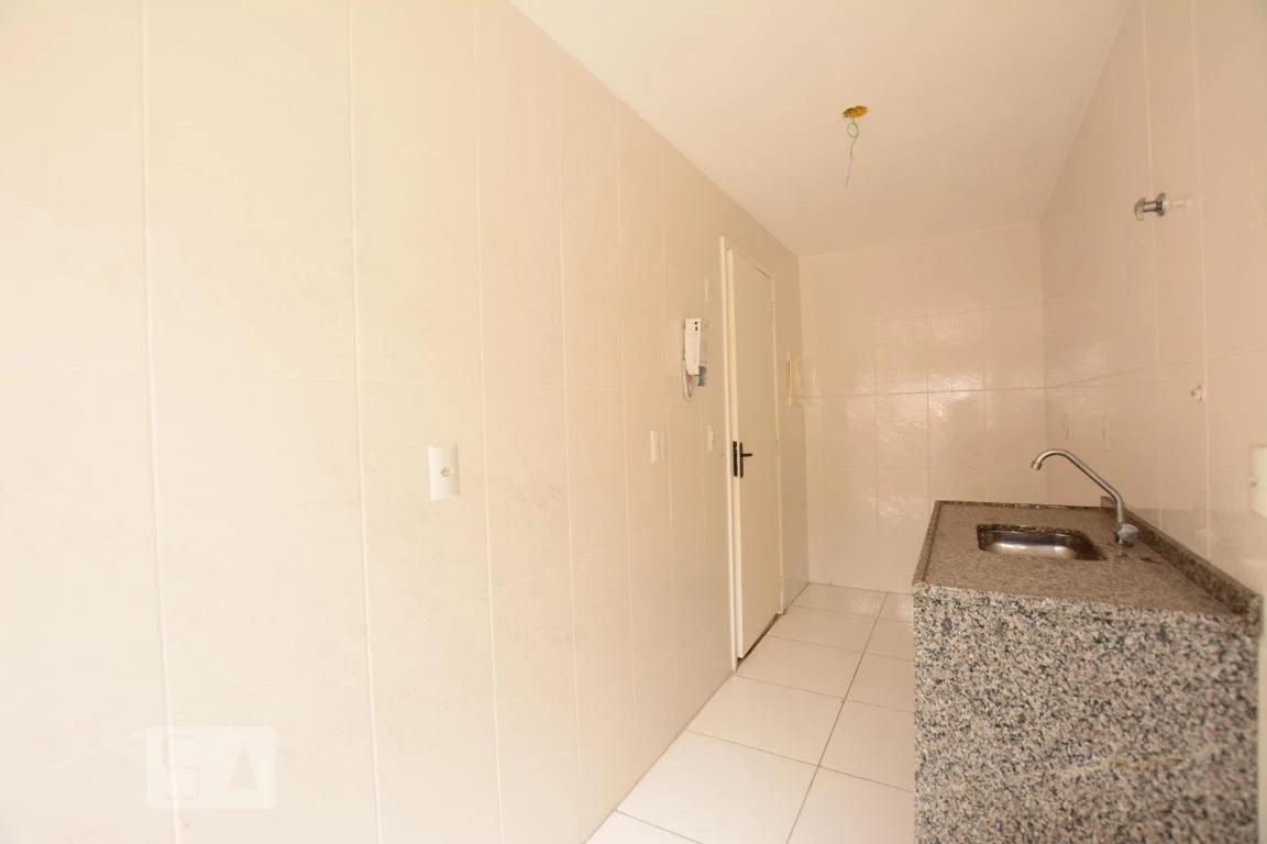 2-bedroom apartment with balcony sink and utility area — photo 9
