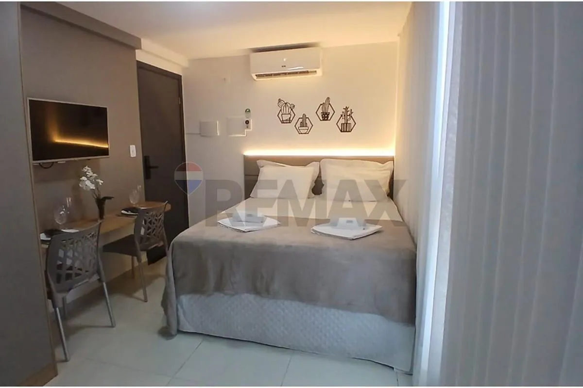 One-bedroom apartment in a building with a pool — photo 14