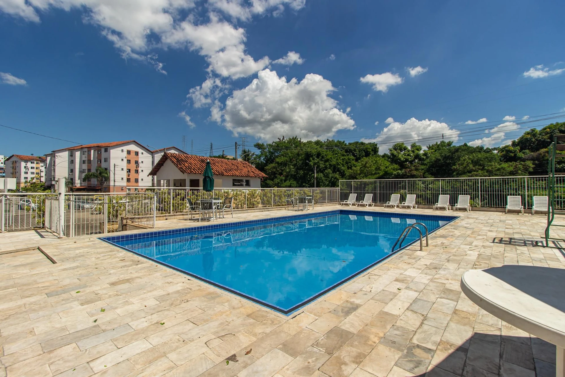 2-bedroom apartment in a building with a pool — photo 19