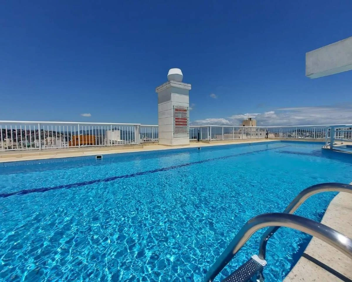 2-bedroom apartment in a building with a pool — photo 19
