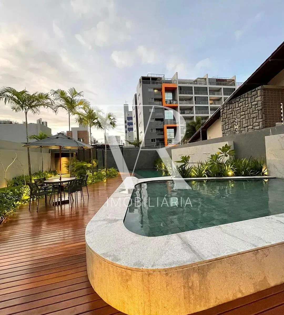 2-bedroom apartment in a building with a pool — photo 13