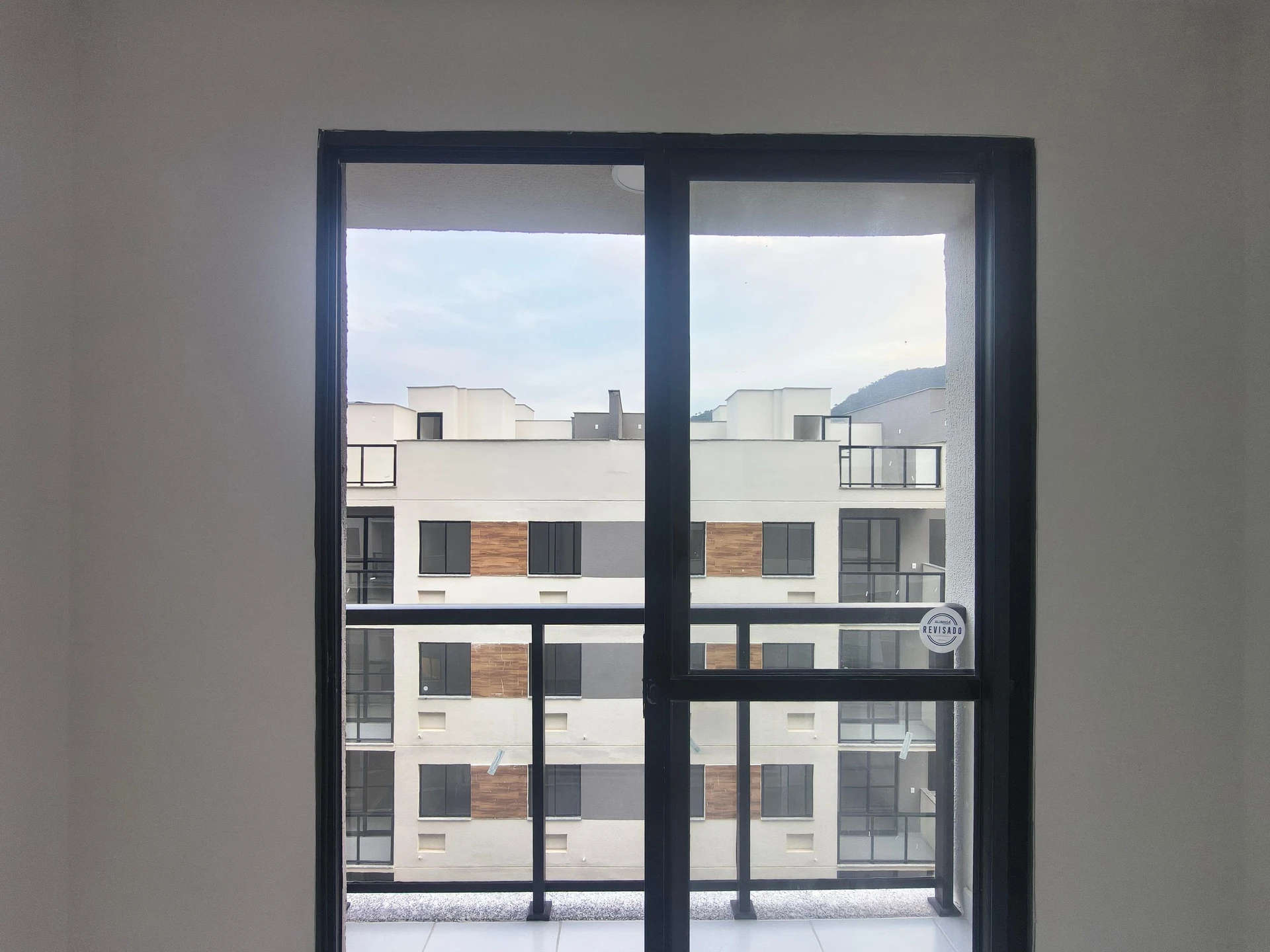 2-bedroom apartment with balcony and glass-enclosed shower