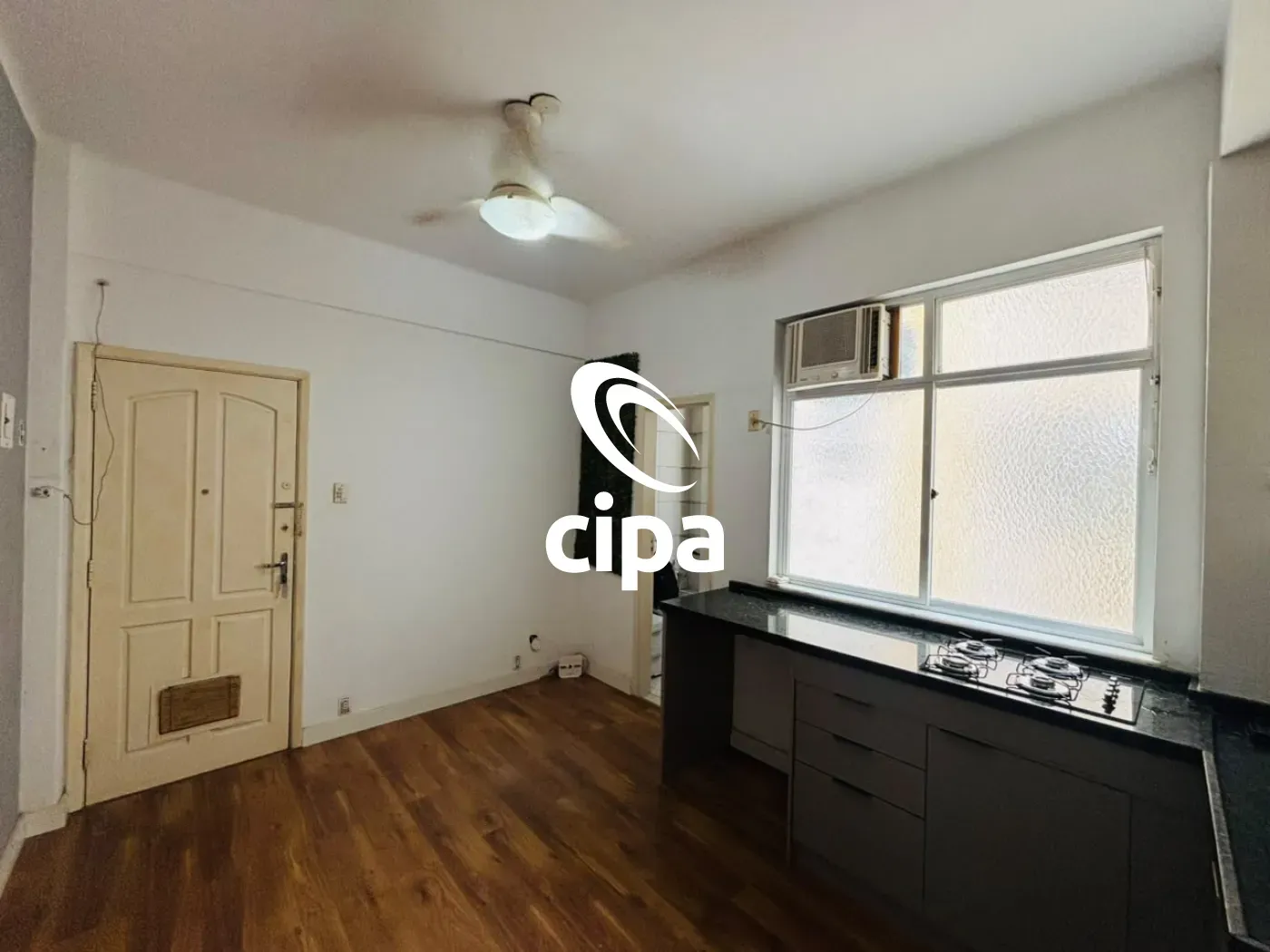 One-bedroom apartment with wood or laminate floors — photo 11