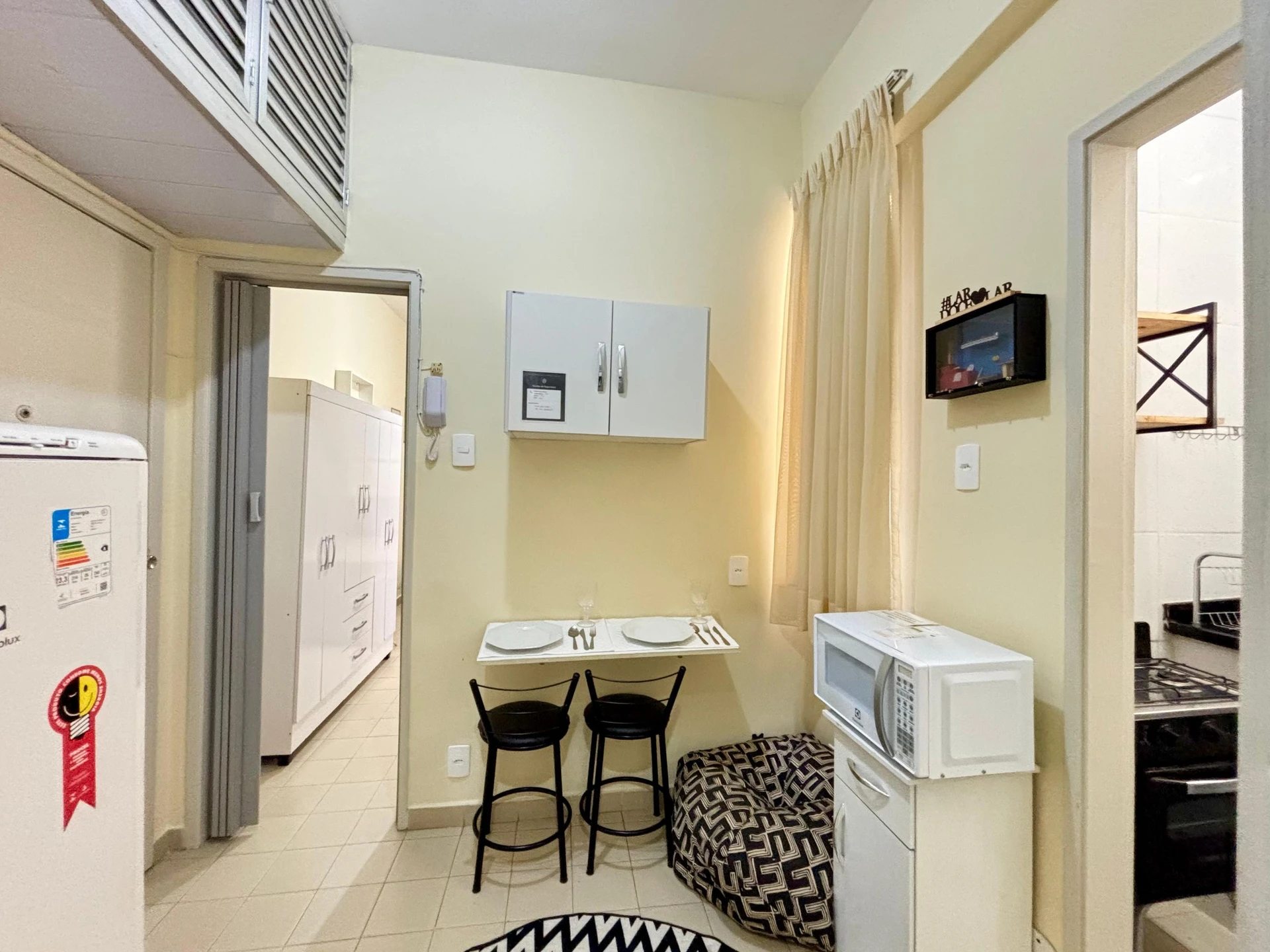 Furnished studio with 1 bedroom and a glass shower — photo 7