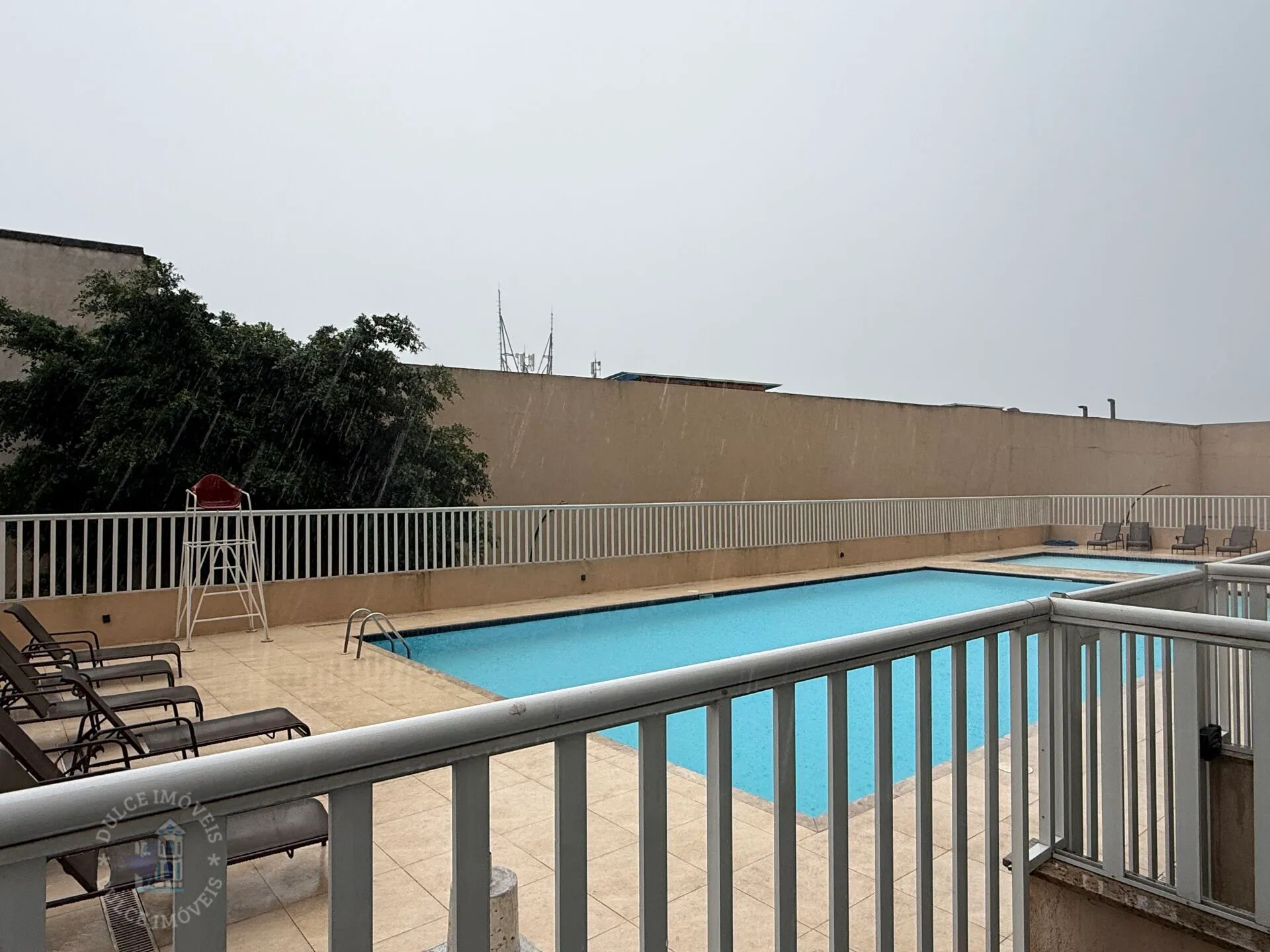 2-bedroom apartment in a building with a pool — photo 9