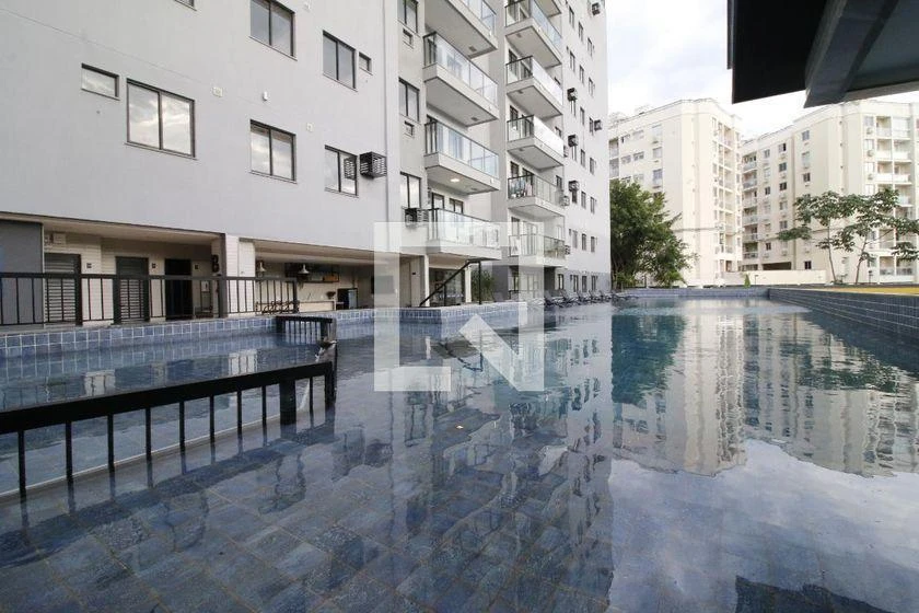 2-bedroom apartment in a building with a pool — photo 24