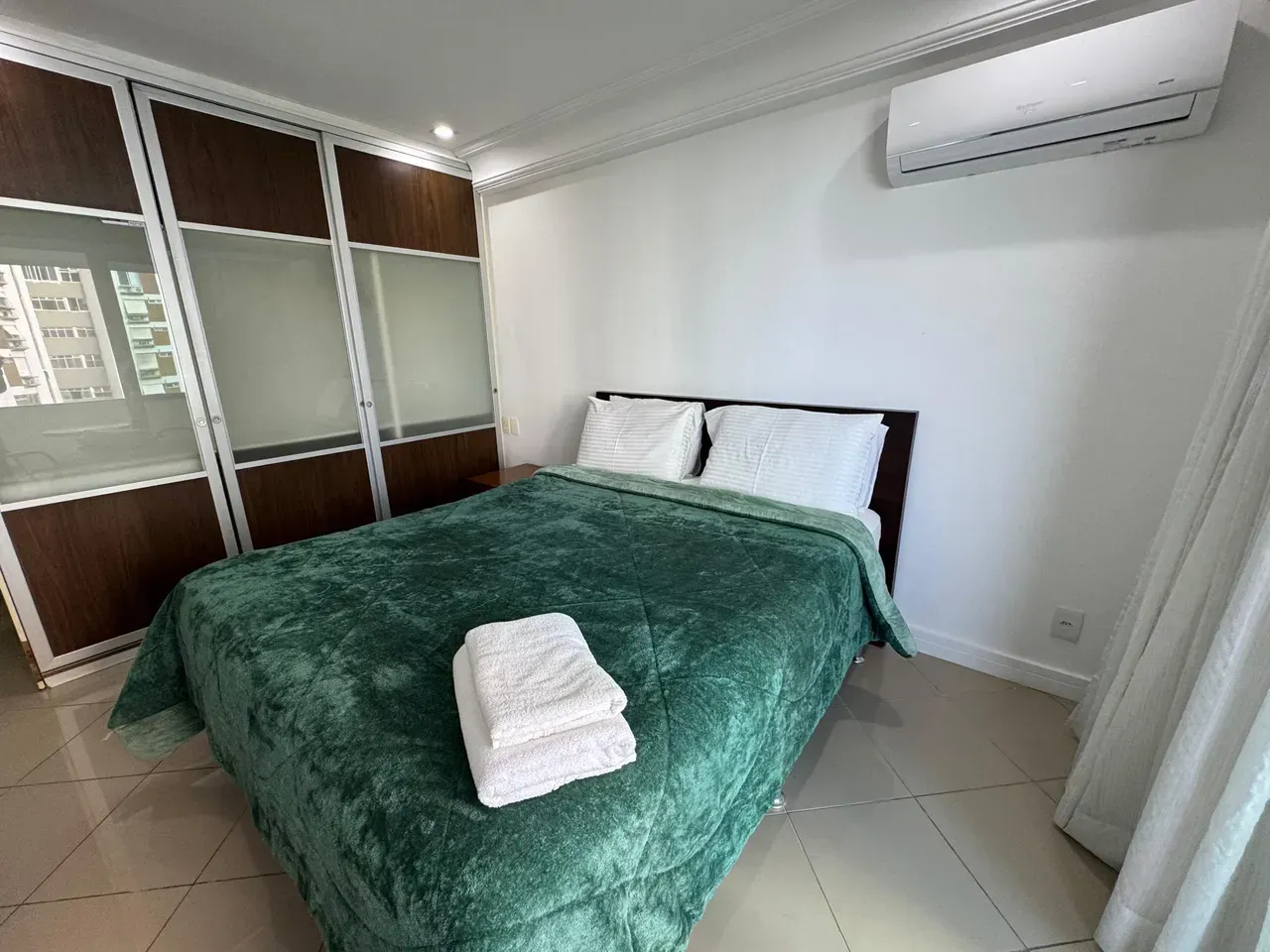 1-bedroom apartment with glass shower and electric showerhead — photo 16