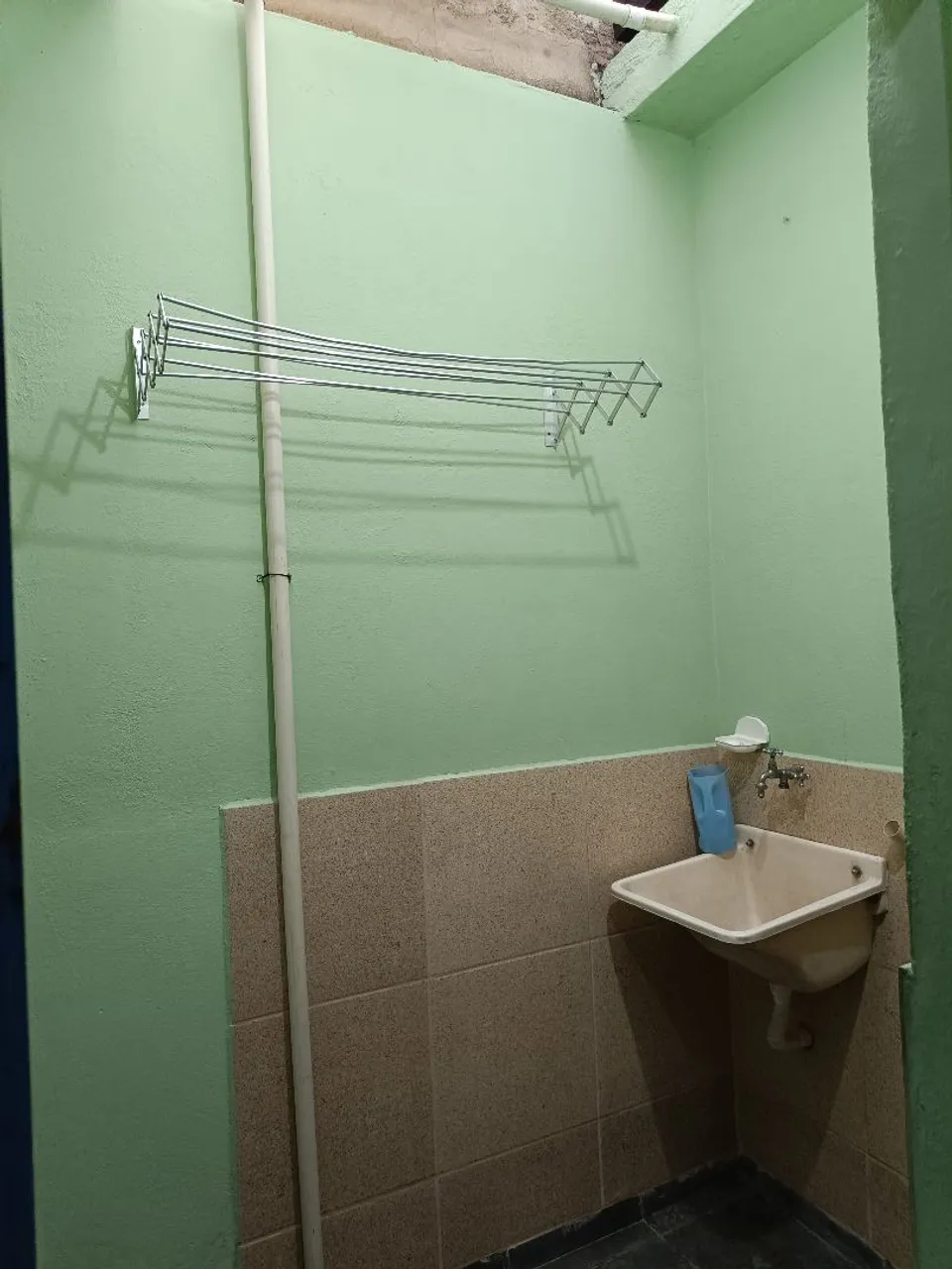 Unfurnished studio with a gas stove and laundry area — photo 7