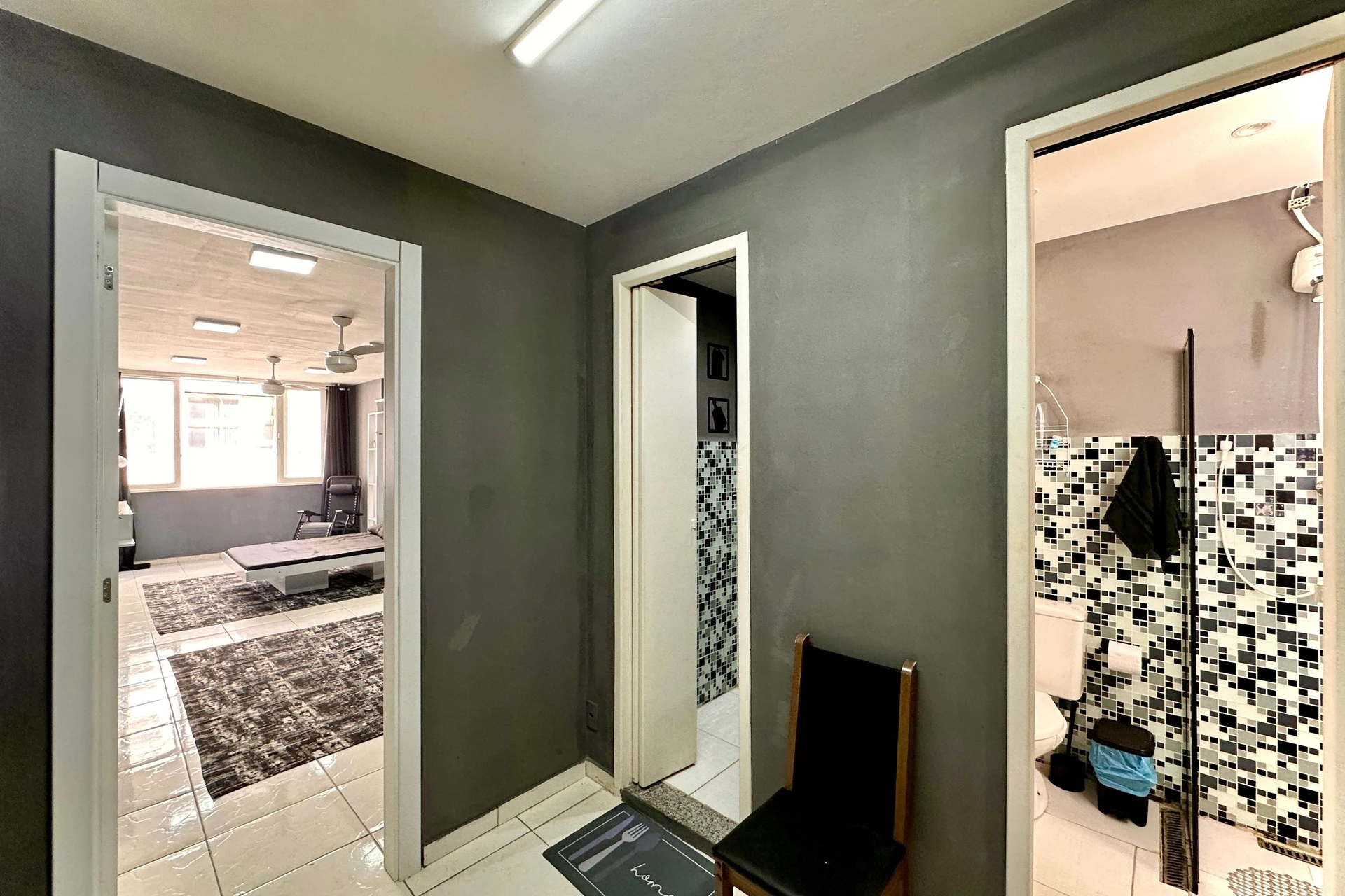 Furnished studio with 1 bedroom and a glass shower — photo 13