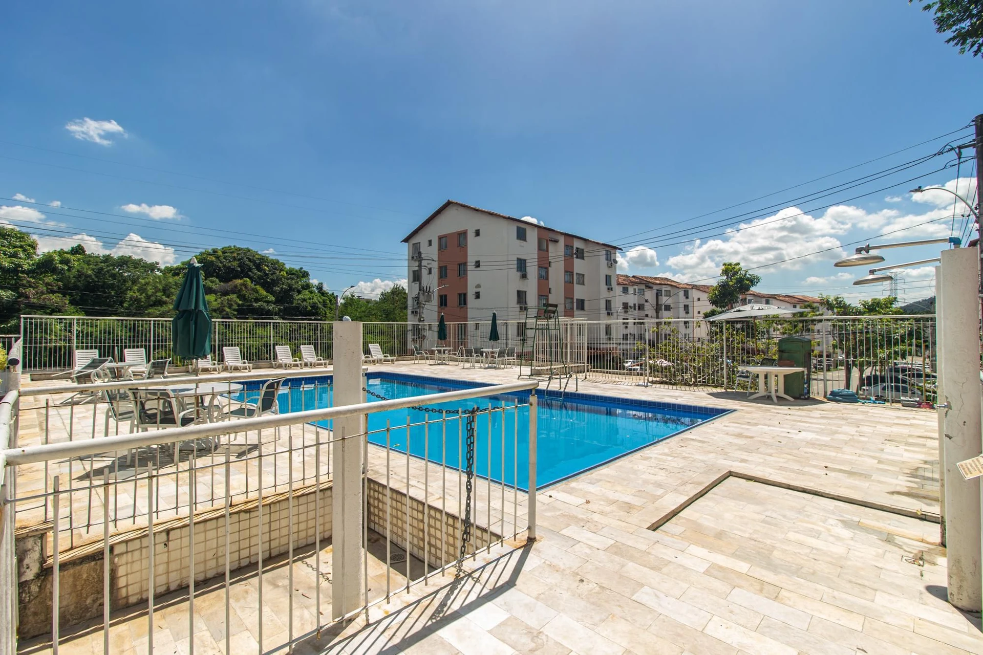 2-bedroom apartment in a building with a pool — photo 10