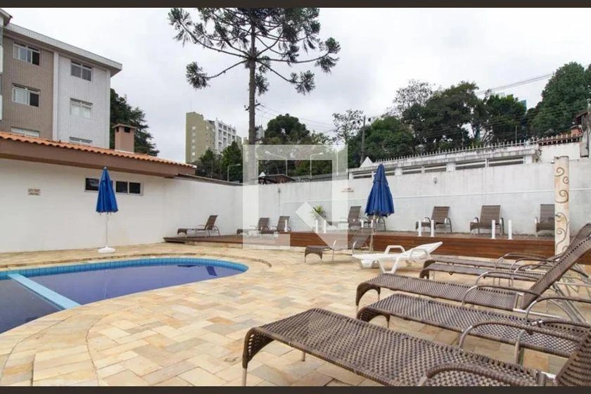 2-bedroom apartment in a building with a pool — photo 16