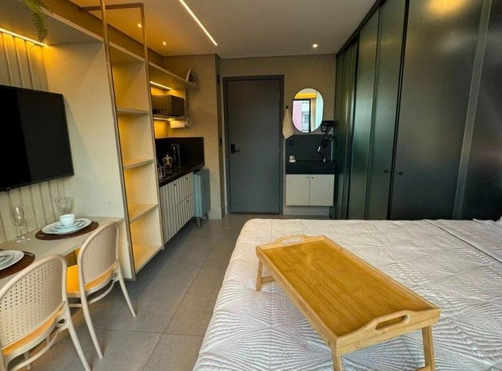 1-bedroom apartment with a compact kitchenette and microwave — photo 4