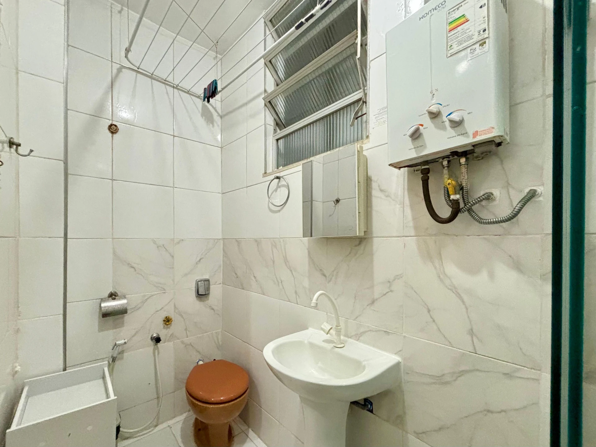 Furnished studio with 1 bedroom and a glass shower — photo 11
