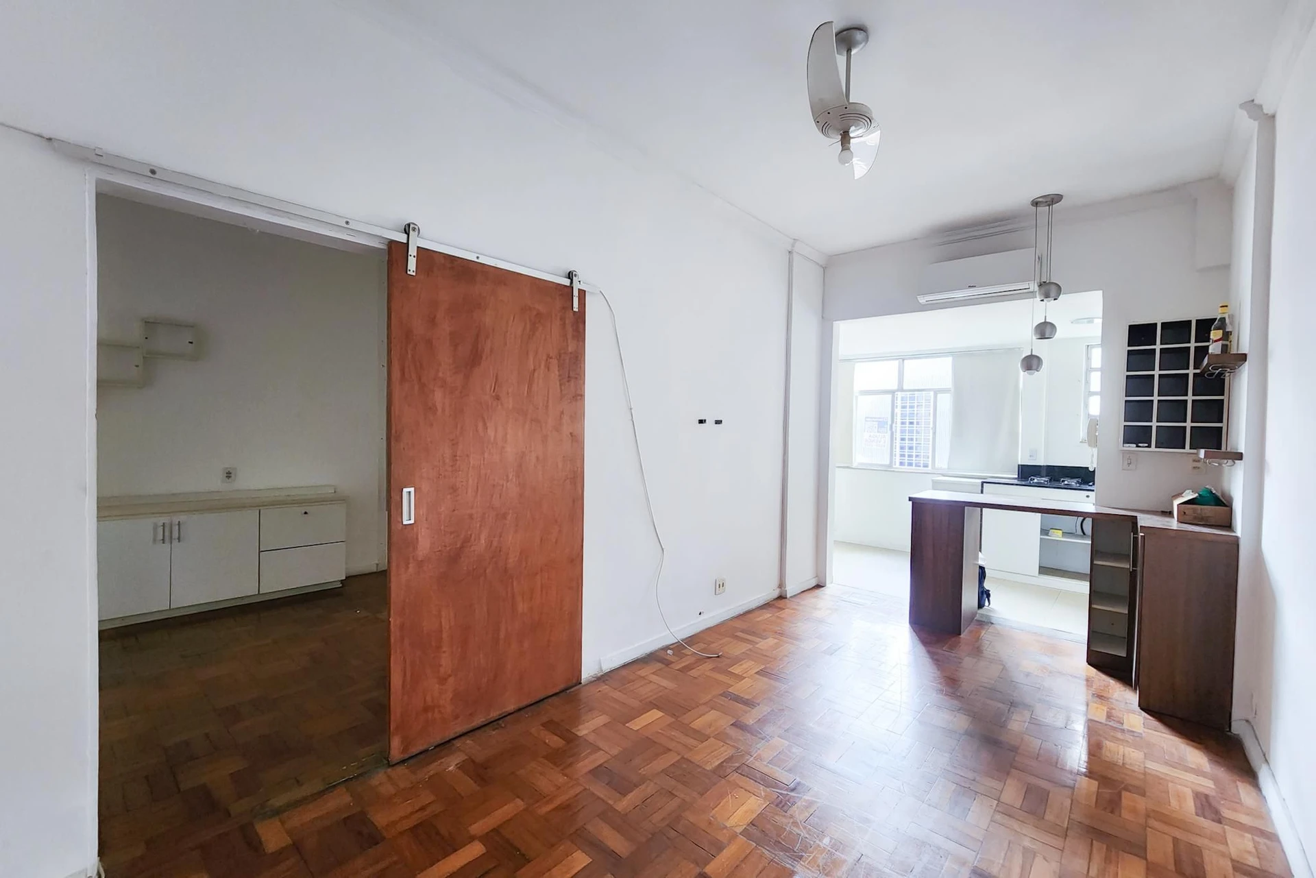 1-bedroom apartment with laundry area and open kitchen