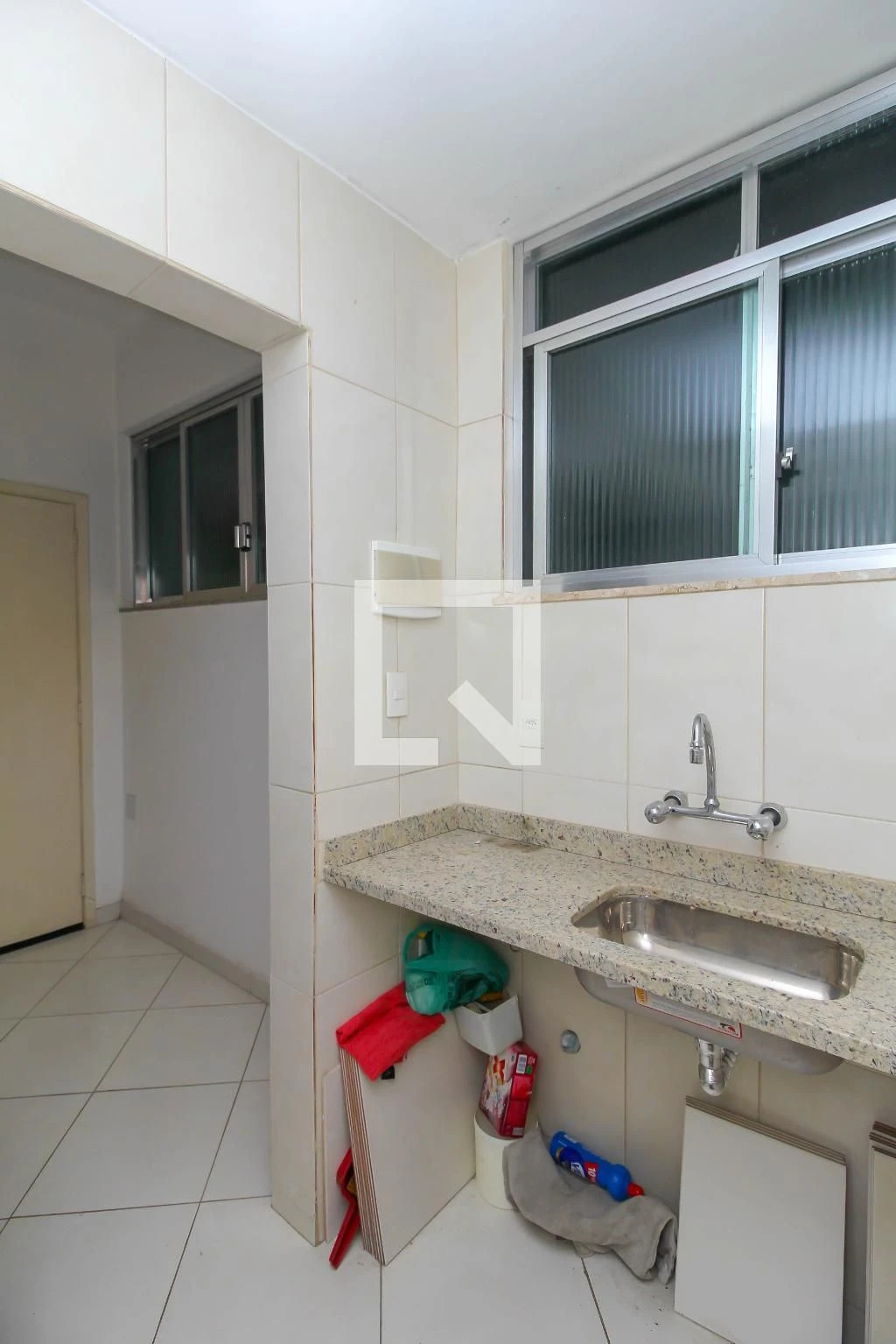 Unfurnished studio with 1 bedroom and kitchenette corner
