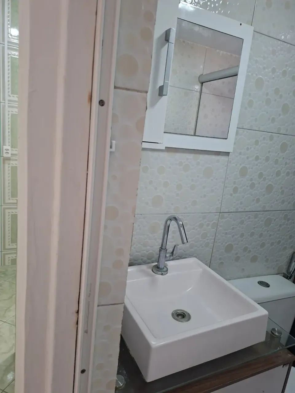 1-bedroom apartment with tiled floors and glass shower — photo 11