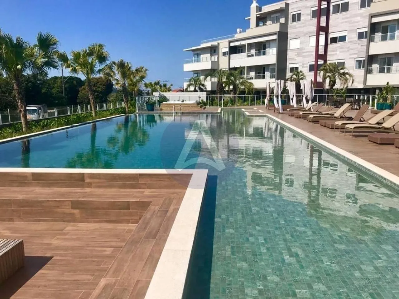 2-bedroom apartment in a building with a pool — photo 13