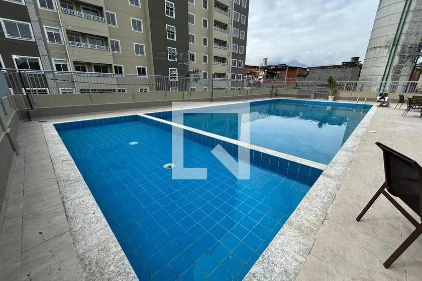 2-bedroom apartment in a building with a pool — photo 10