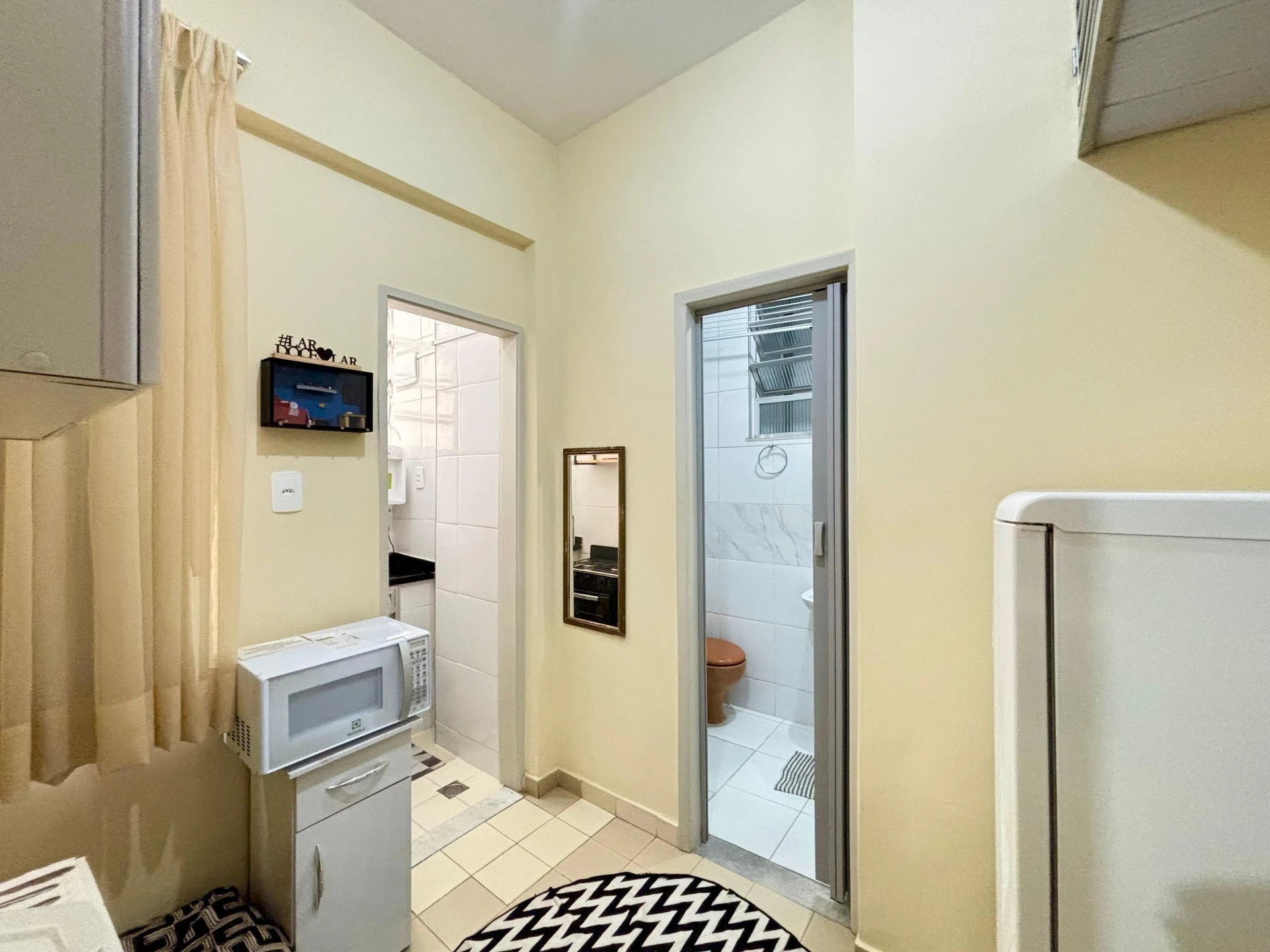 Furnished studio with 1 bedroom and a glass shower — photo 9