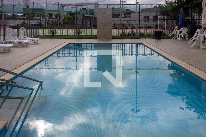 2-bedroom apartment in a building with a pool — photo 10