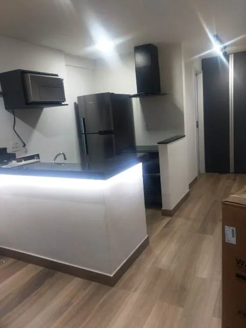 Apartamento de 1 quarto com cozinha aberta e varanda — photo 8